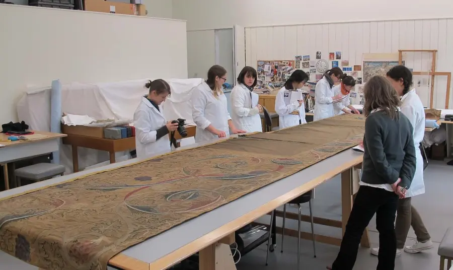 People working on the conservation of the Lanercost dossal