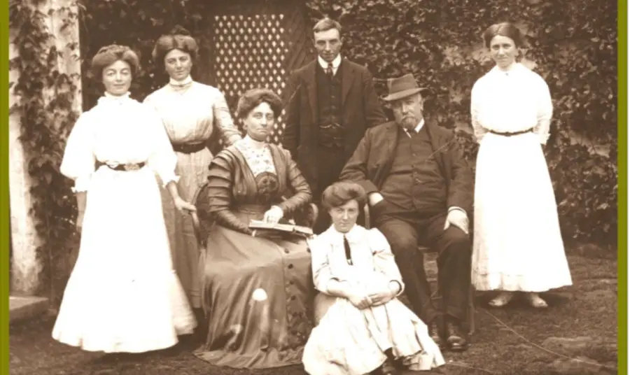The Caldwell family posed outside a building c.1908