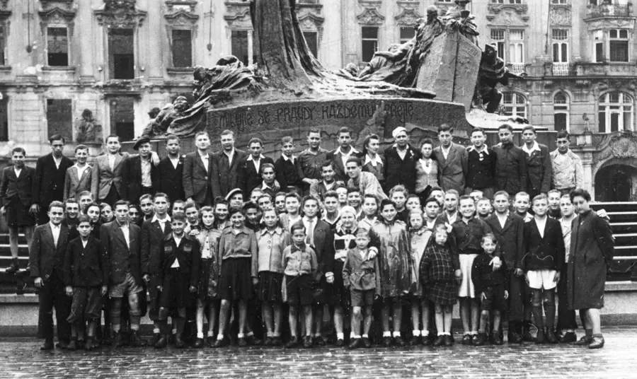 A black-and-white photograph of children in Prague