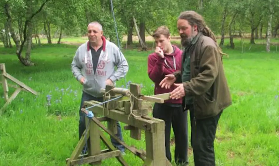 Young people learning about traditional building methods