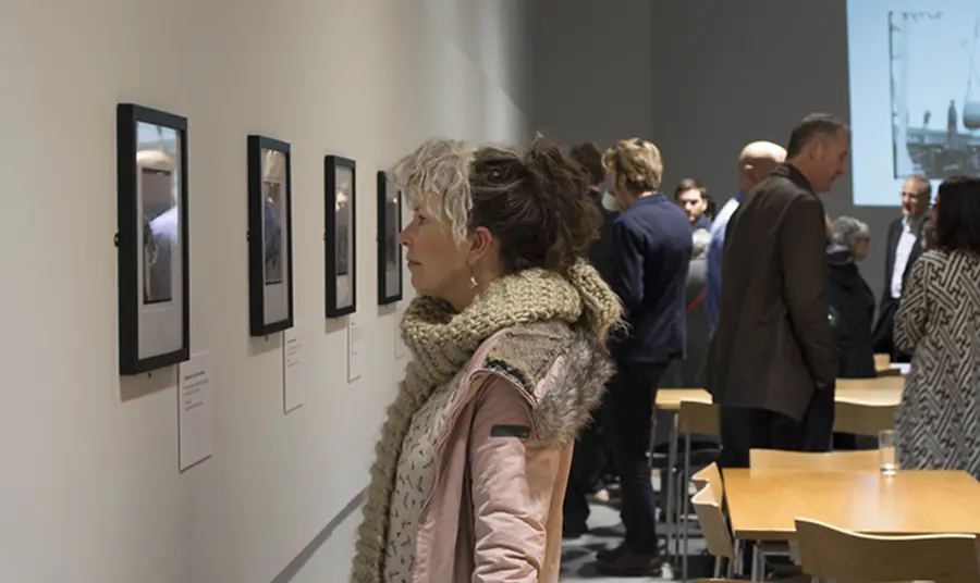 Visitors enjoy the opening of the exhibition