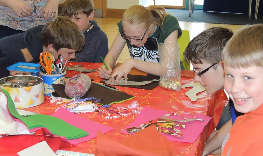 100 years and still serving: a centenary heritage project Members of Sight Support Derbyshire creating a tactile banner