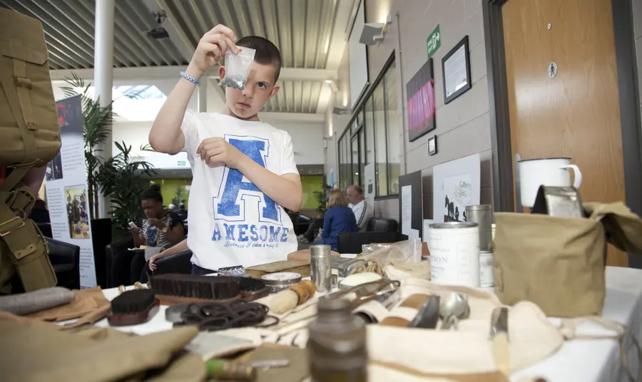 Examining some First World War artefacts at a community workshop