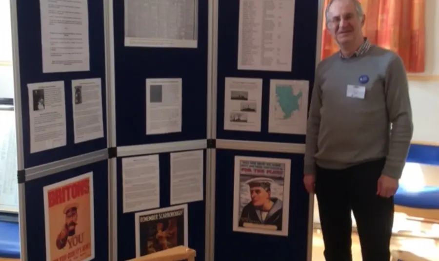 A man standing by exhibition boards on the Battle of Jutland