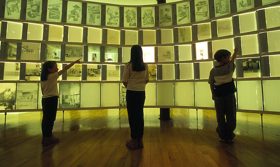 Children point to screens at the Lighthouse, Glasgow