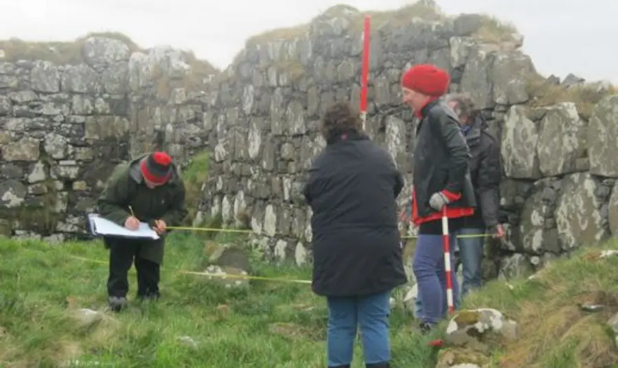 Participants measuring an archaeological sie