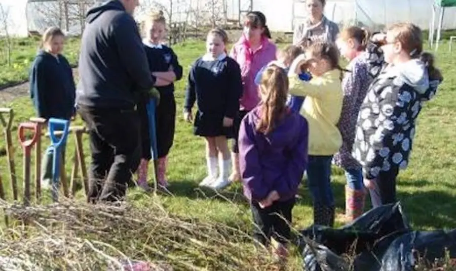 School children being taught about the importance of hedgerow