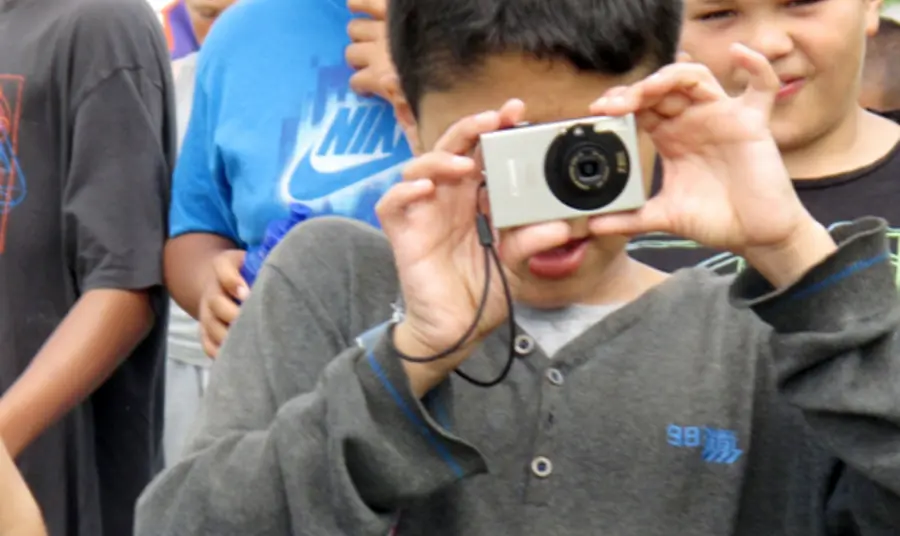 Young people taking photographs