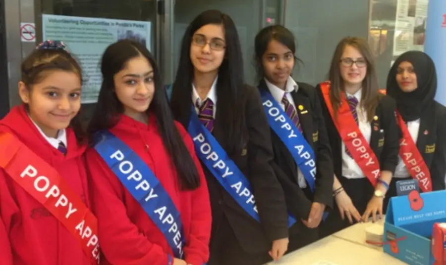 Young people sell poppies