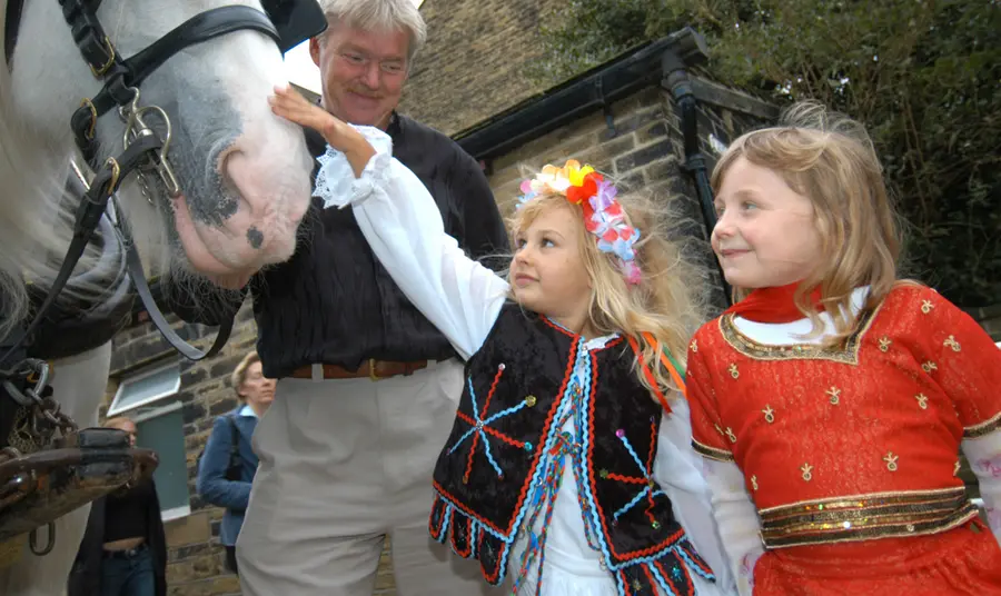 Children pet a horse at Bradford Industrial Museum