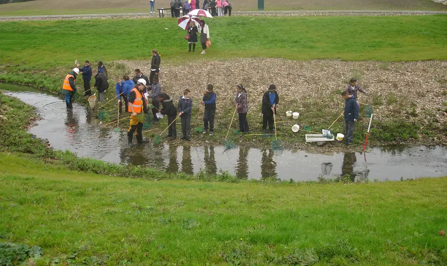 Young people and volunteers by the River Wandle