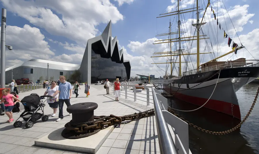 Visitors walk alongside Riverside Museum, Glasgow