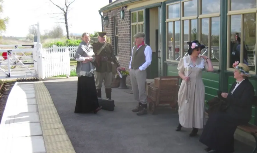 People in historic dress at Scruton Station