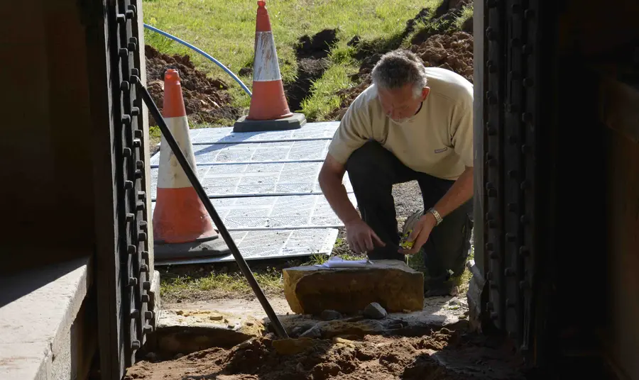 A stonemason gets to work at St Mary's Church Wreay