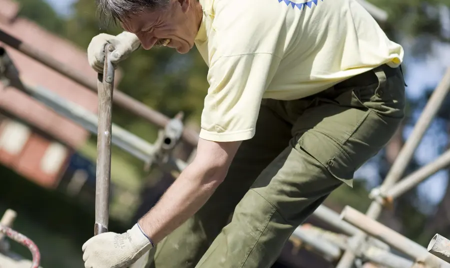 A Chiltern Open Air Museum volunteer at work