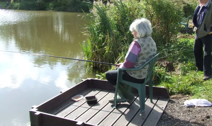 Woman fishing in the Trent Vale