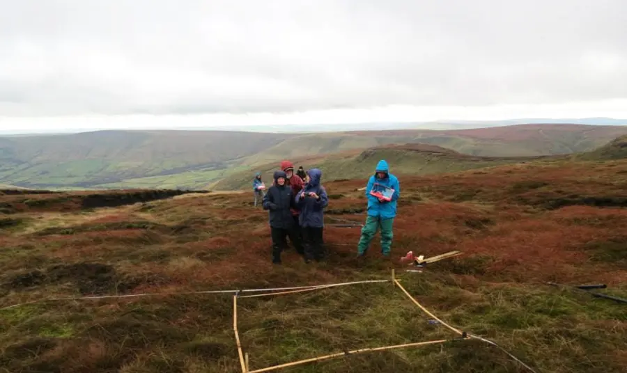 Volunteers square plotting on the moors