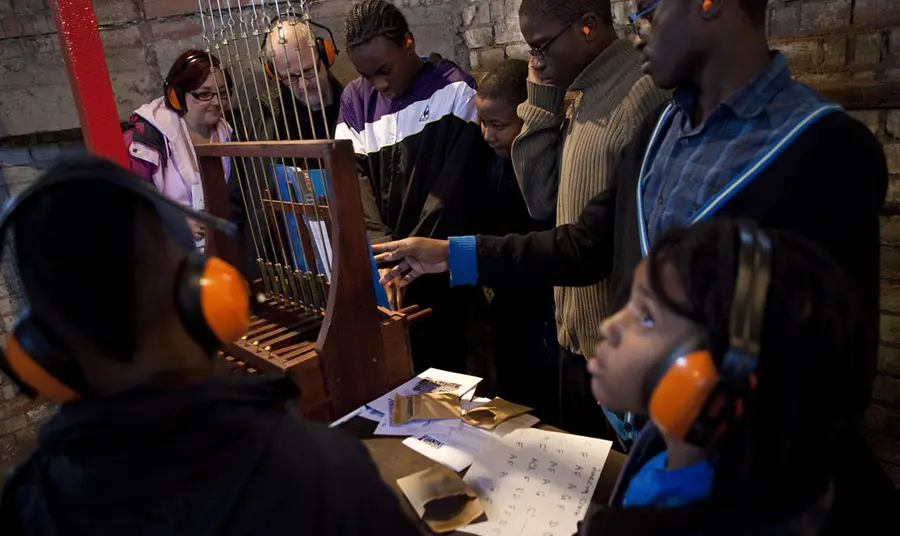 Children learning about the chiming bells