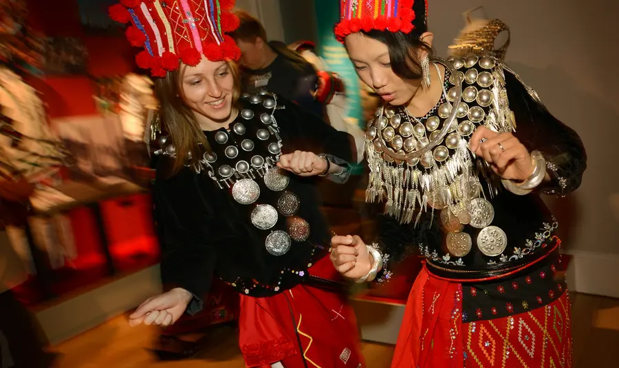 Young people learn a traditional dance in costume