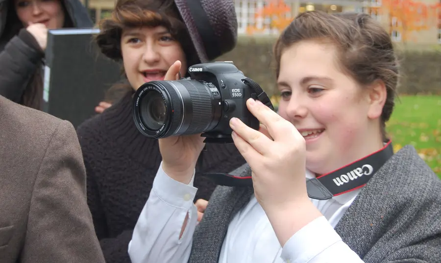 Young people making use of professional photography equipment