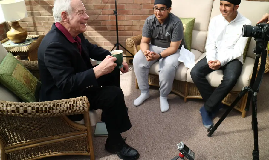Young hockey players interview older people