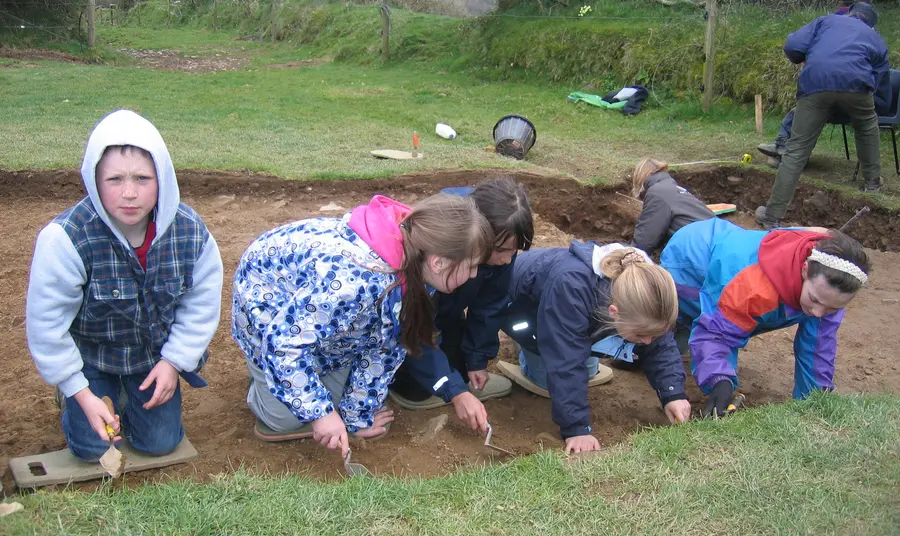 Children take part in an excavation