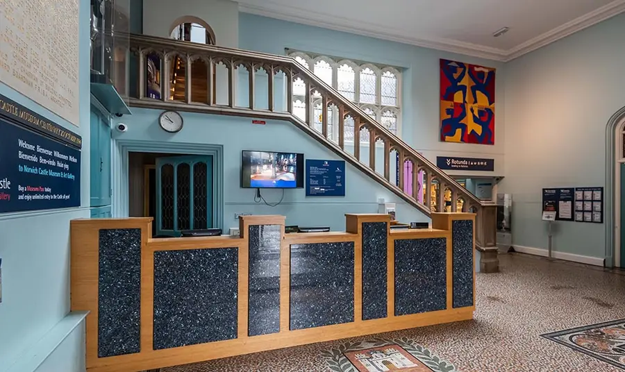 A ticket desk in a historic building