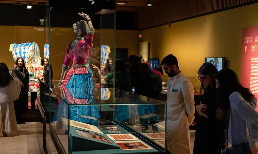 Visitors browse the displays in Manchester Museum's South Asia Gallery.