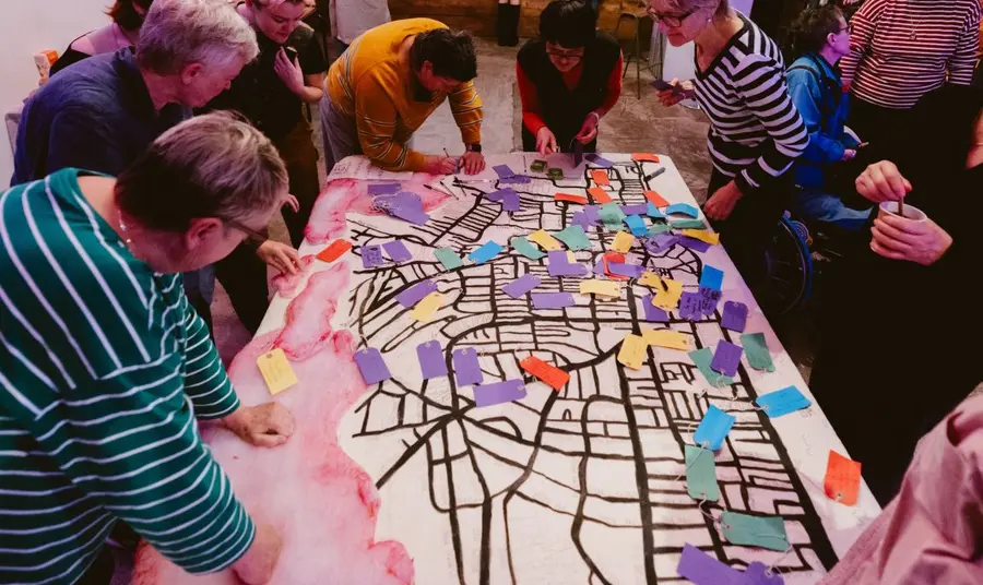 Group of people exploring stories as part of Lesbian Archive Reboot event