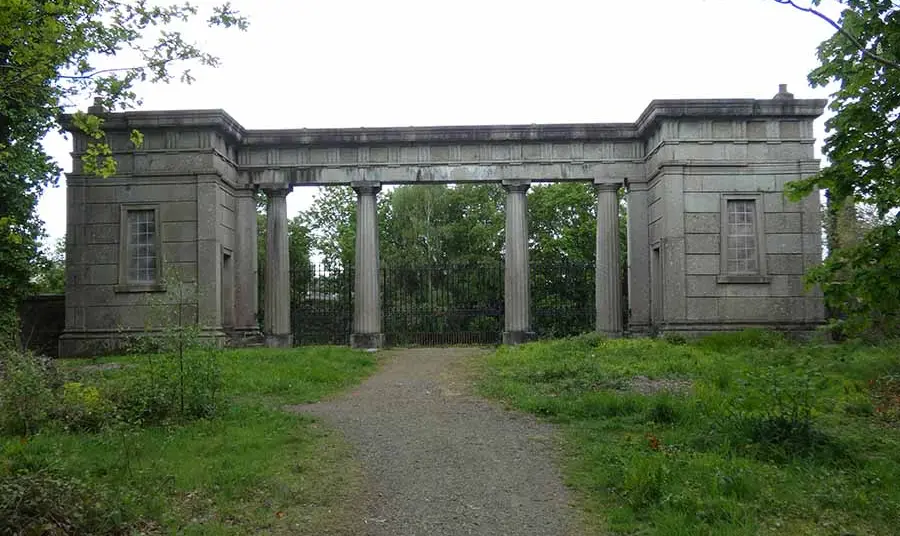Granite Lodge amongst trees and grass.