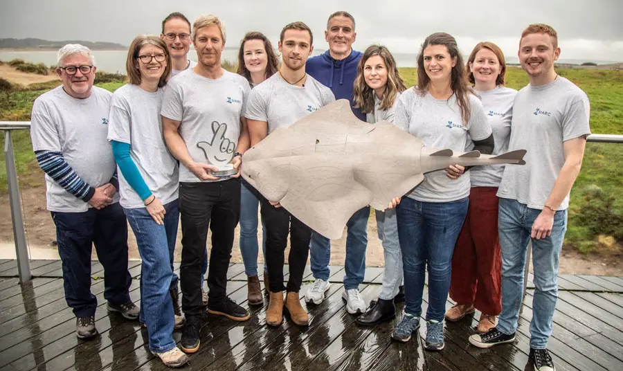 The team stand with the National Lottery Award