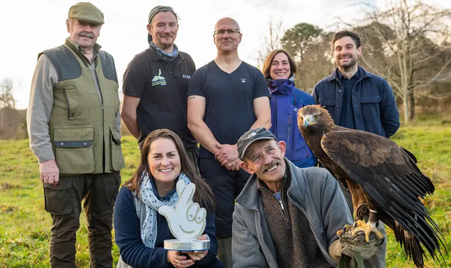 The team from the South of Scotland Golden Eagle Project. The team from the South of Scotland Golden Eagle Project pose with a Golden Eagle.
