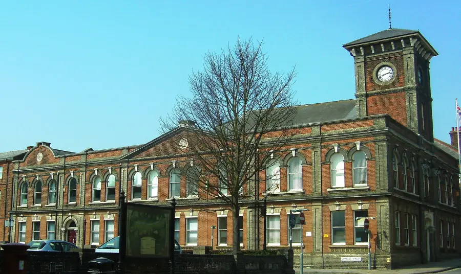Photograph of the Town Hall, a large red brick building with a clock tower