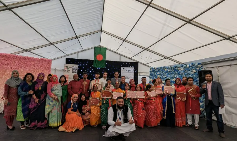 Group photo of people wearing Bengali dress