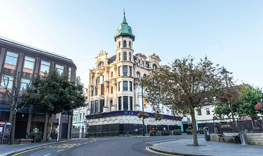 Austins department store, a large corner building constructed of pale stone with spired tower