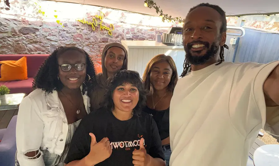 A group of young people smiling