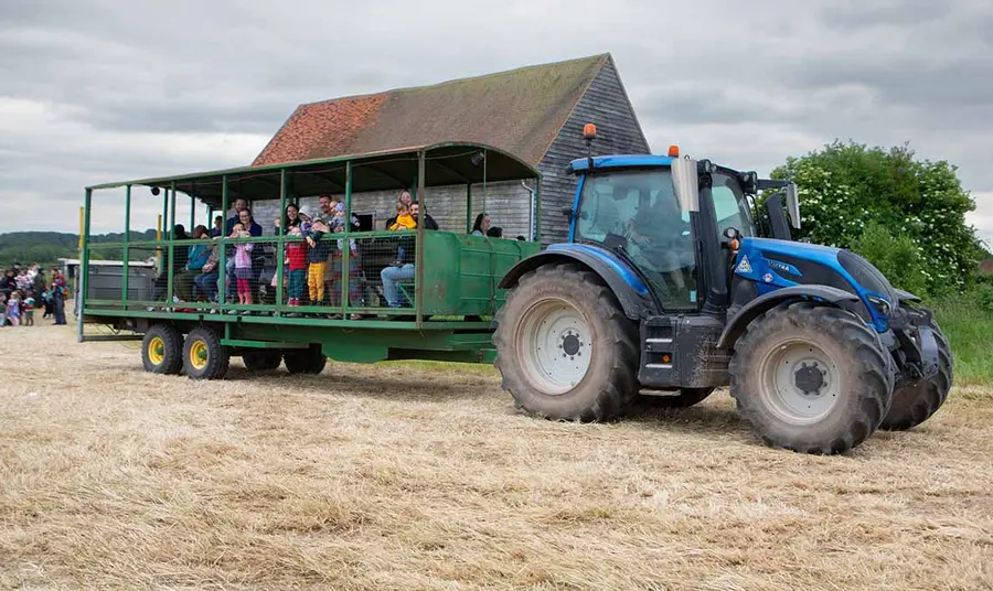 Visitors on the back of a tractor at Woodoaks Farm.