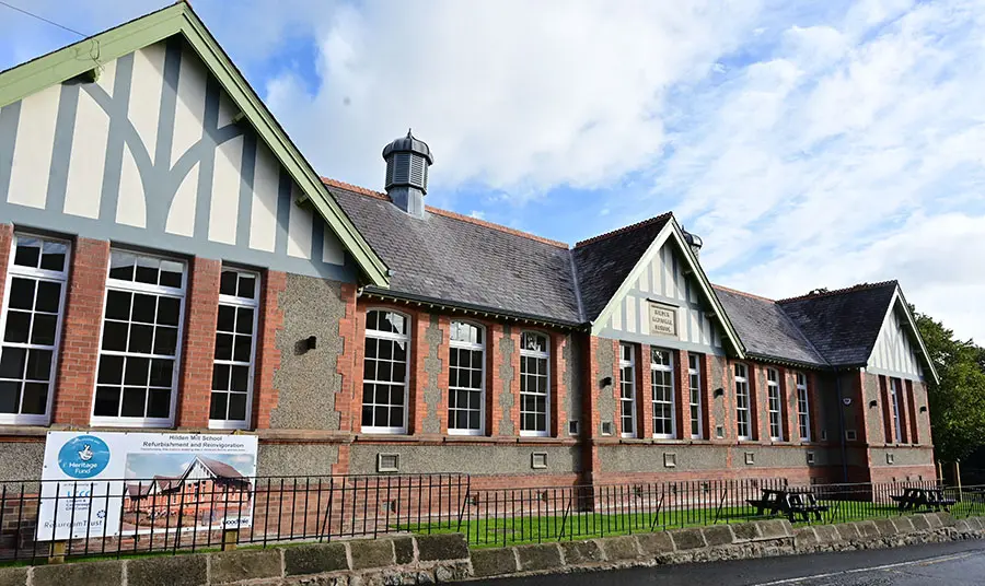 A restored nineteenth-century brick school building
