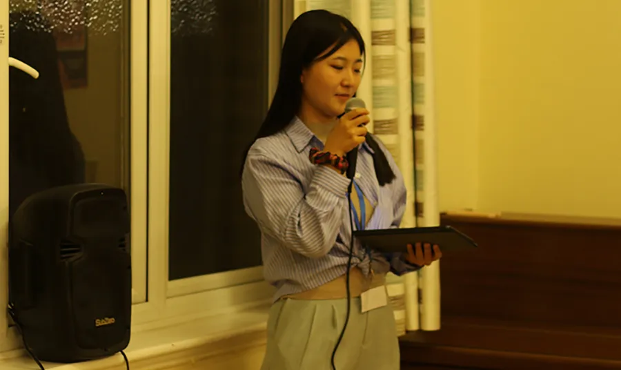 A person speaks into a microphone