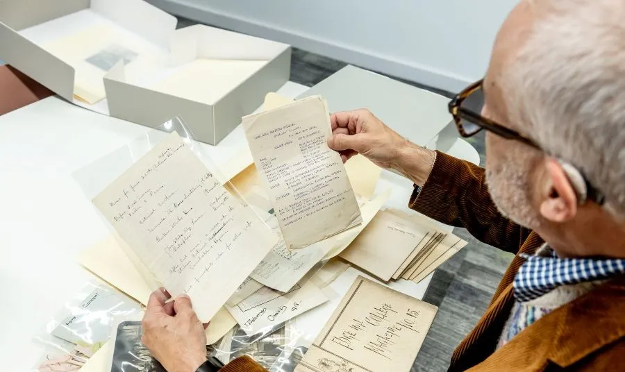 a person looks at old documents