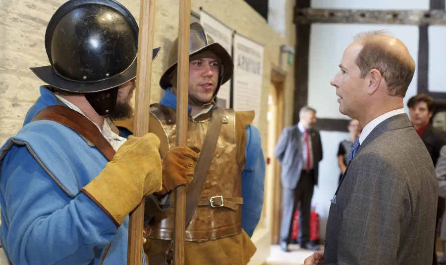 His Royal Highness Prince Edward talks to people in Civil War era outfits
