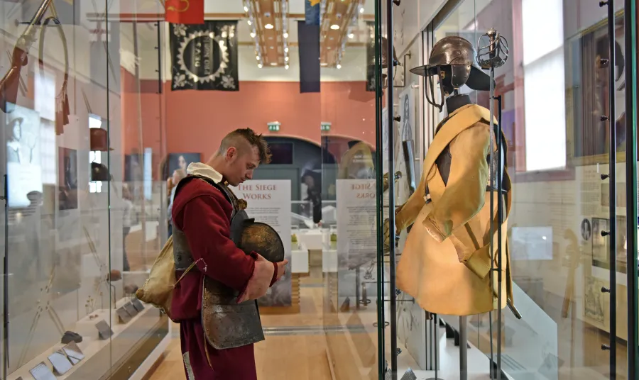 A re-enactor examines an exhibit at the Civil War Centre