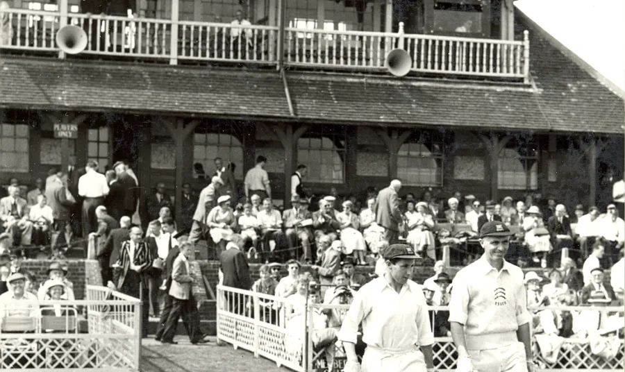 Archive photo of cricketers and crowds in front of the pavilion