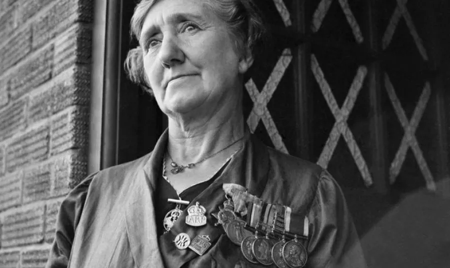 A widow wearing her husband's medals
