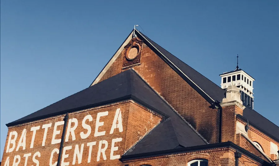 The exterior of Battersea Arts Centre, with it's name painted on the brick in bold capitals