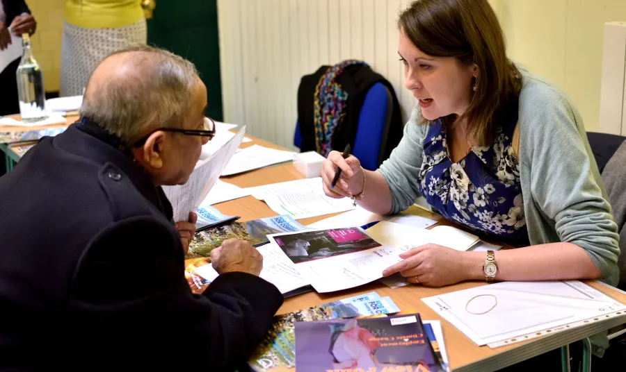 HLF staff member speaking to applicant at an event