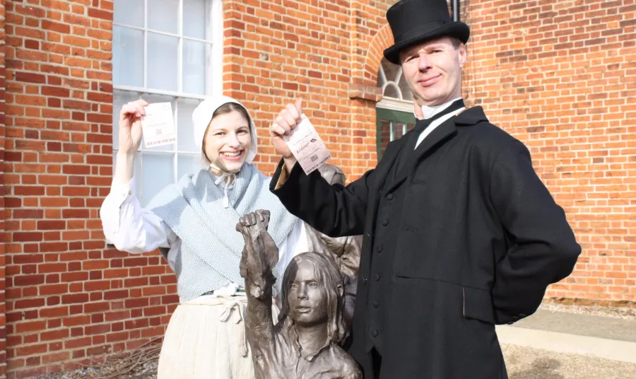 Costumed actors with Lottery tickets