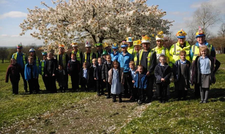 Primary school children meet construction workers and apprentices at New Bolsover Model Village