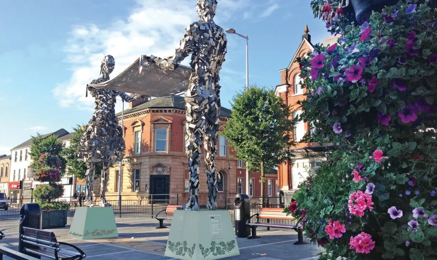 Metal statue of two people