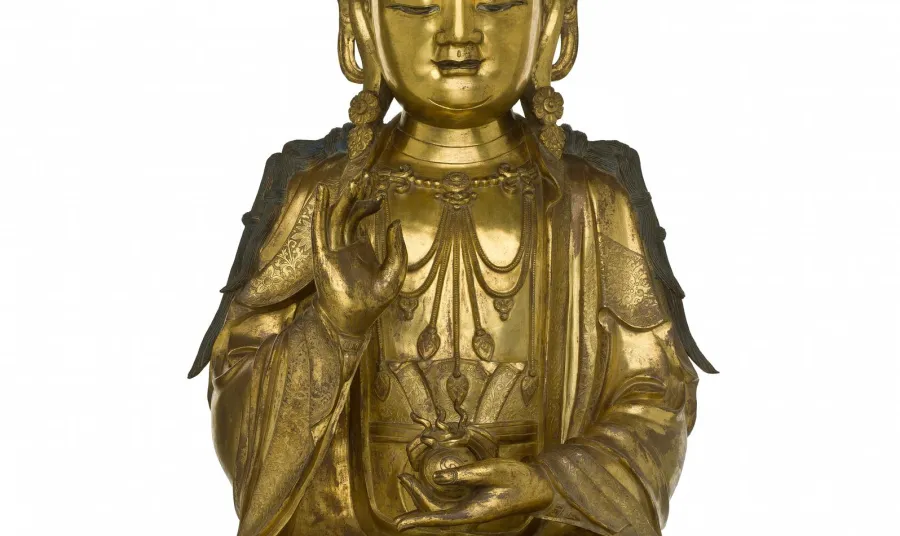 Figure of a bodhisattva in gilt bronze, holding a flaming jewel in left hand